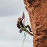 A mountain climber trusting his rope